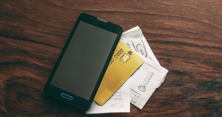 Mobile phone with credit card and receipts