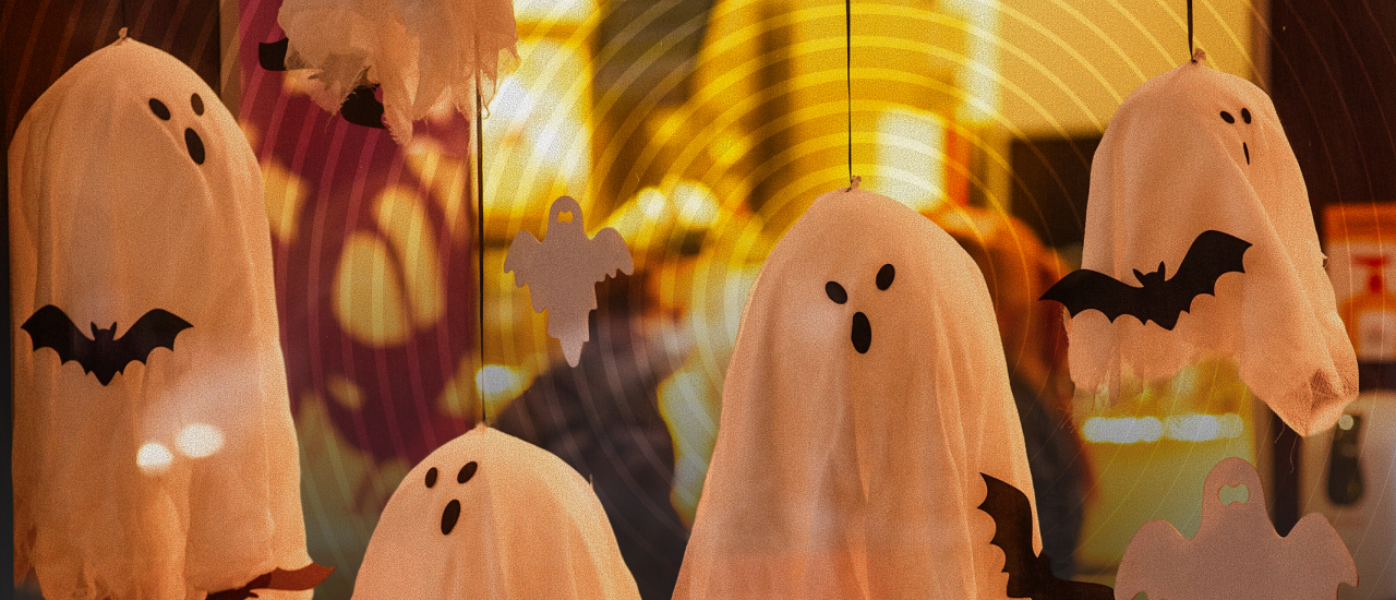 Halloween retail display with hanging ghost and bat decorations, representing 2026 Halloween shopping trends, seasonal merchandising, and consumer spending.